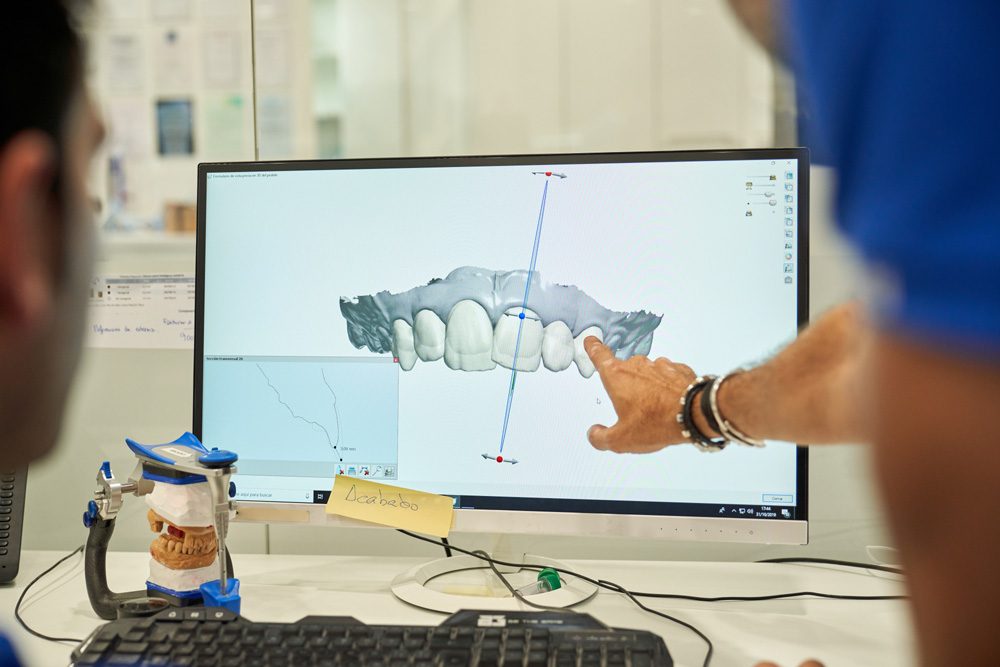 prosthodontists examining denture